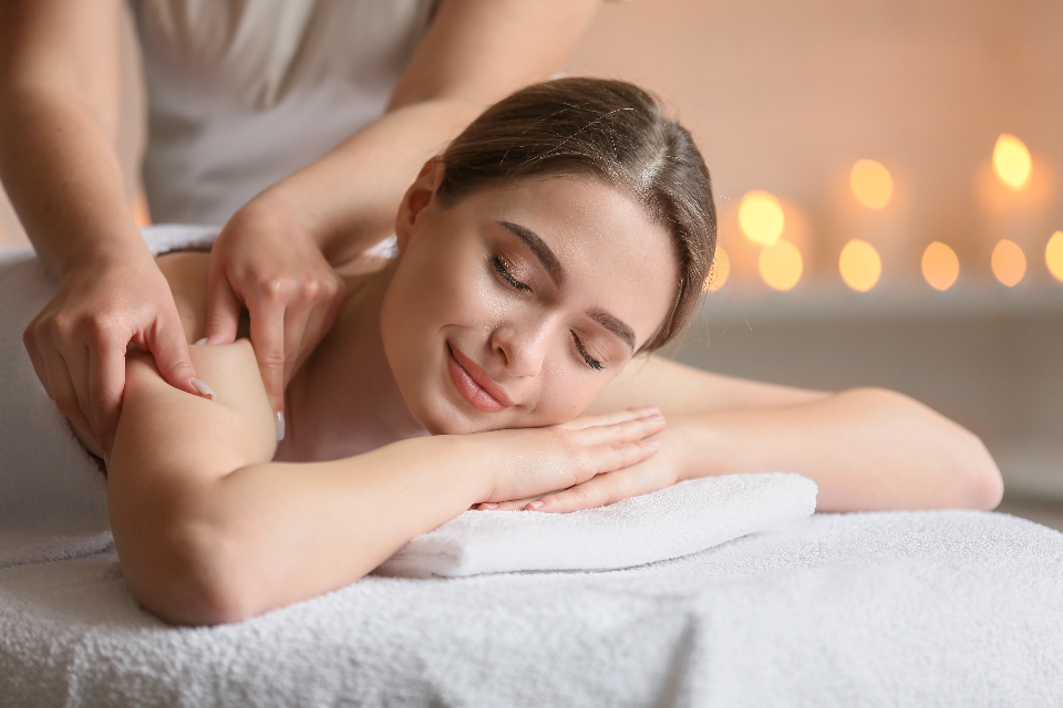 Client relaxing during a massage treatment