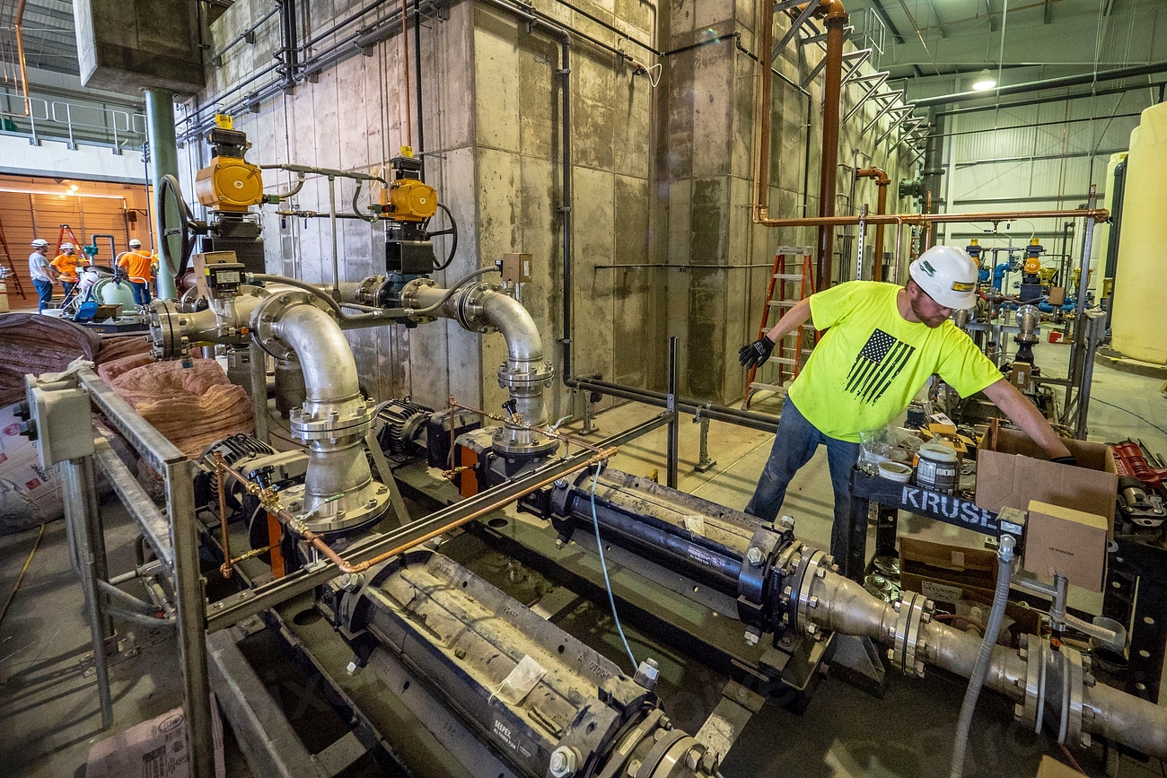 Plumber working on a commercial pipe system
